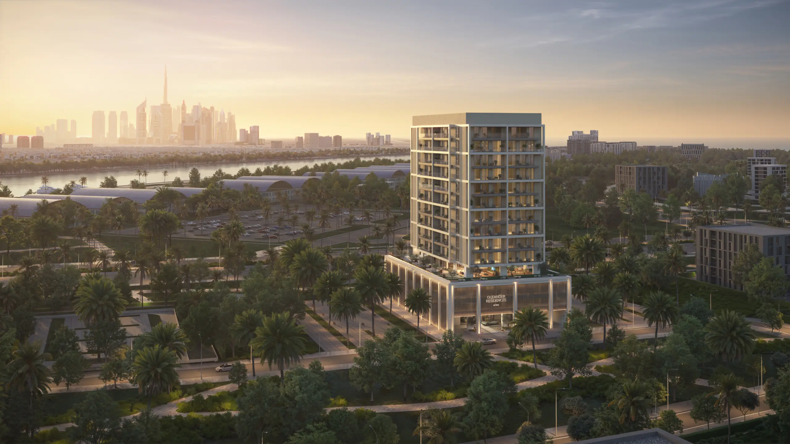 Aerial view of Oleander Residences at sunset, with the Dubai skyline across the water