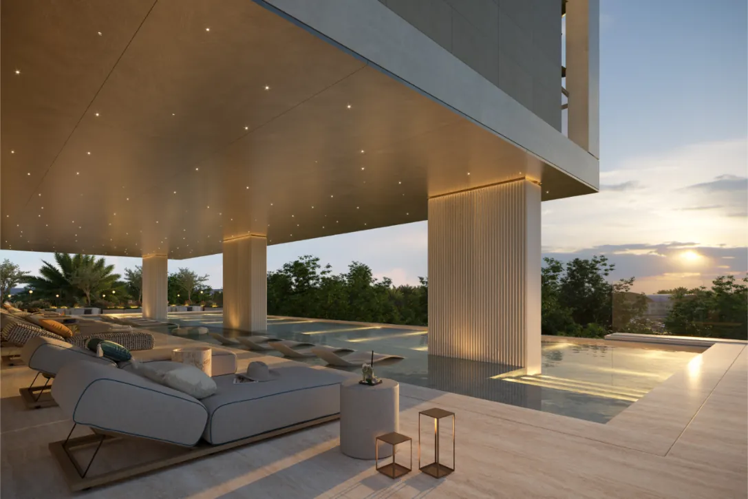 Pool deck at sunset beneath the tower
